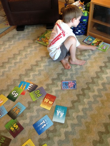 Lining up his new funny Alpha Cards