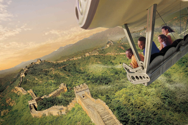 Guests will celebrate the U.S. debut of the new Soarin&apos; Around the World attraction at The Land pavilion this summer. Now with a third Epcot theater, plus new digital screens and projection systems, the expanded attraction takes guests on an exhilarating "flight" above spectacular global landscapes and man-made wonders. (Photo illustration, Disney) (PRNewsFoto/Walt Disney World Resort)